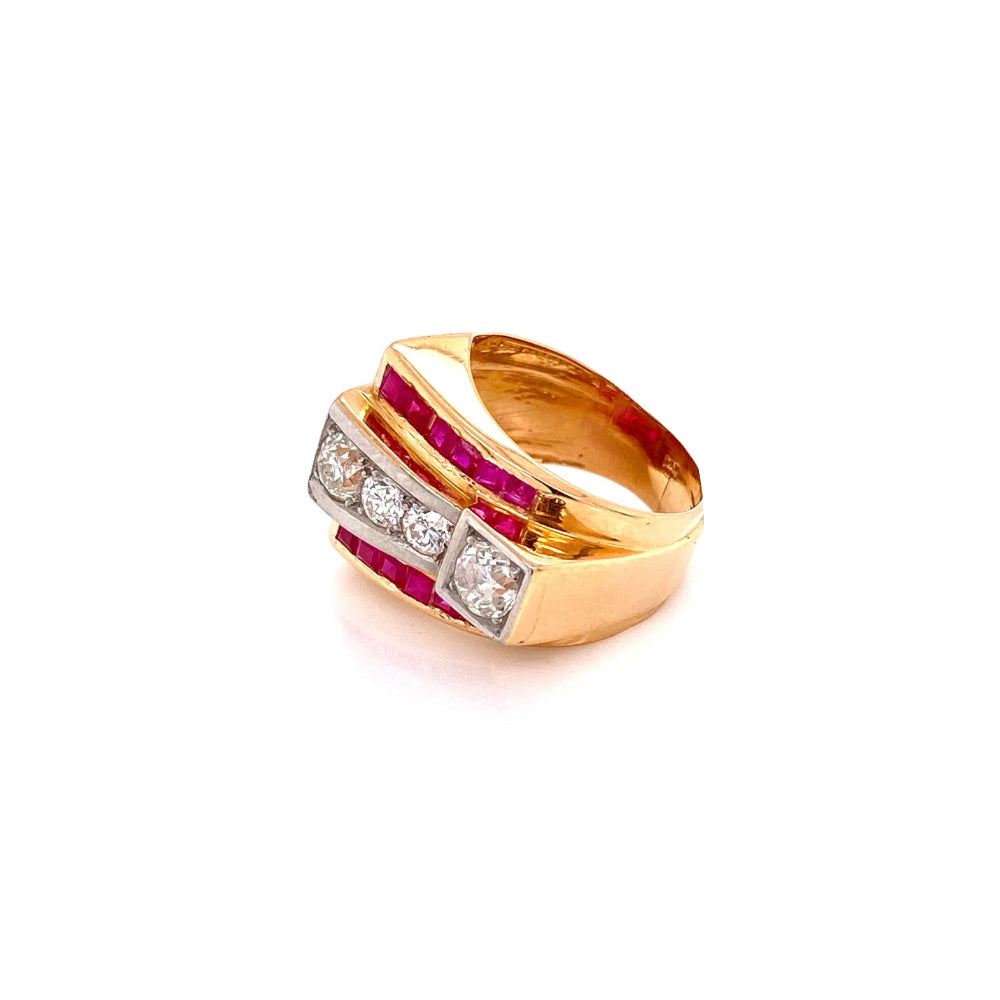 A yellow gold ring with a multi-band design featuring three round diamonds and rows of vibrant pink rubies, set against a plain white background.