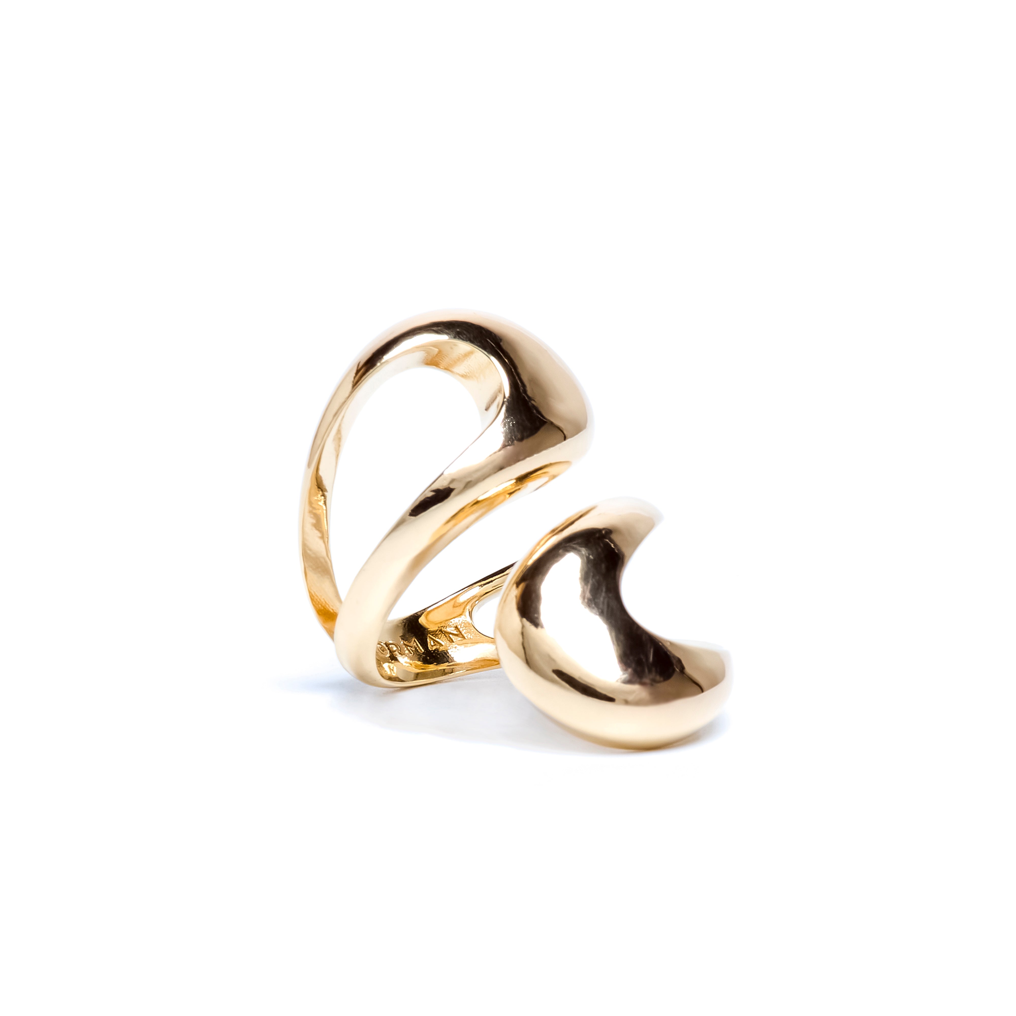 Gold heart-shaped ring on a white background