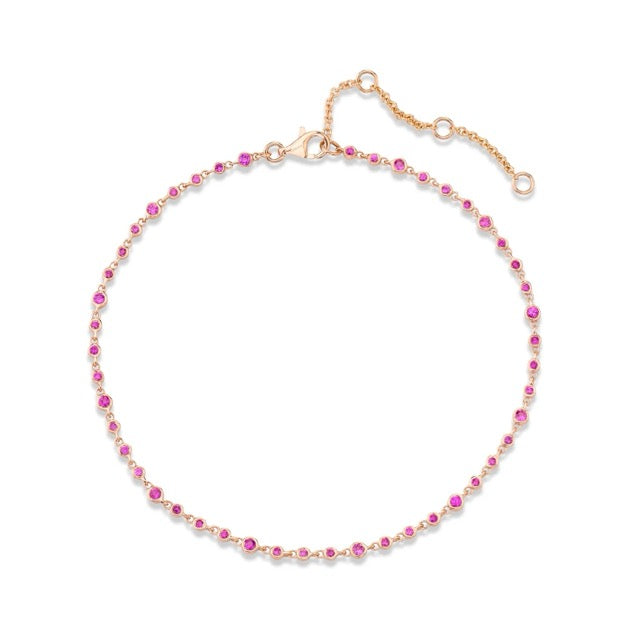 Rose Gold bracelet with pink beads on a white background