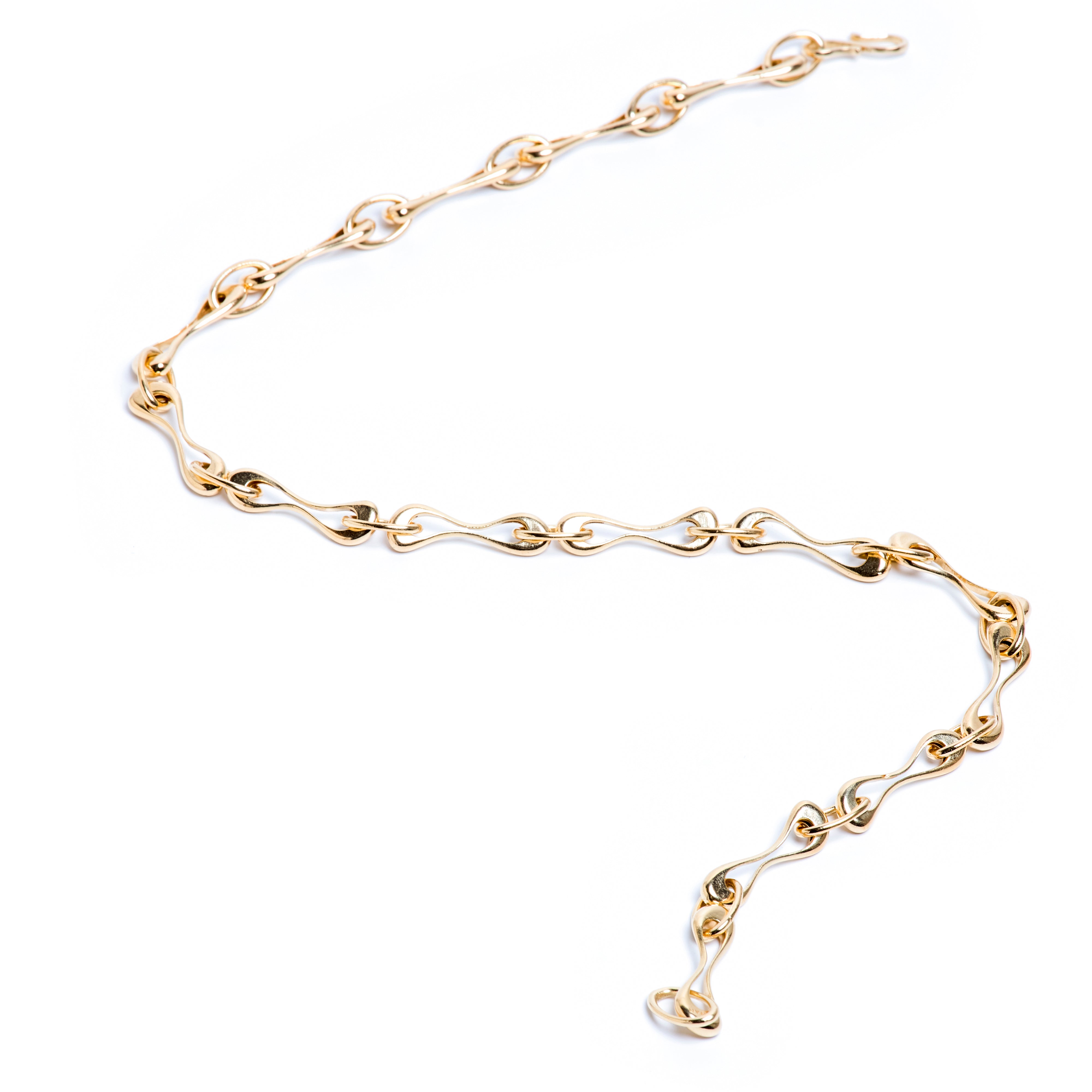 Gold chain bracelet on a white background