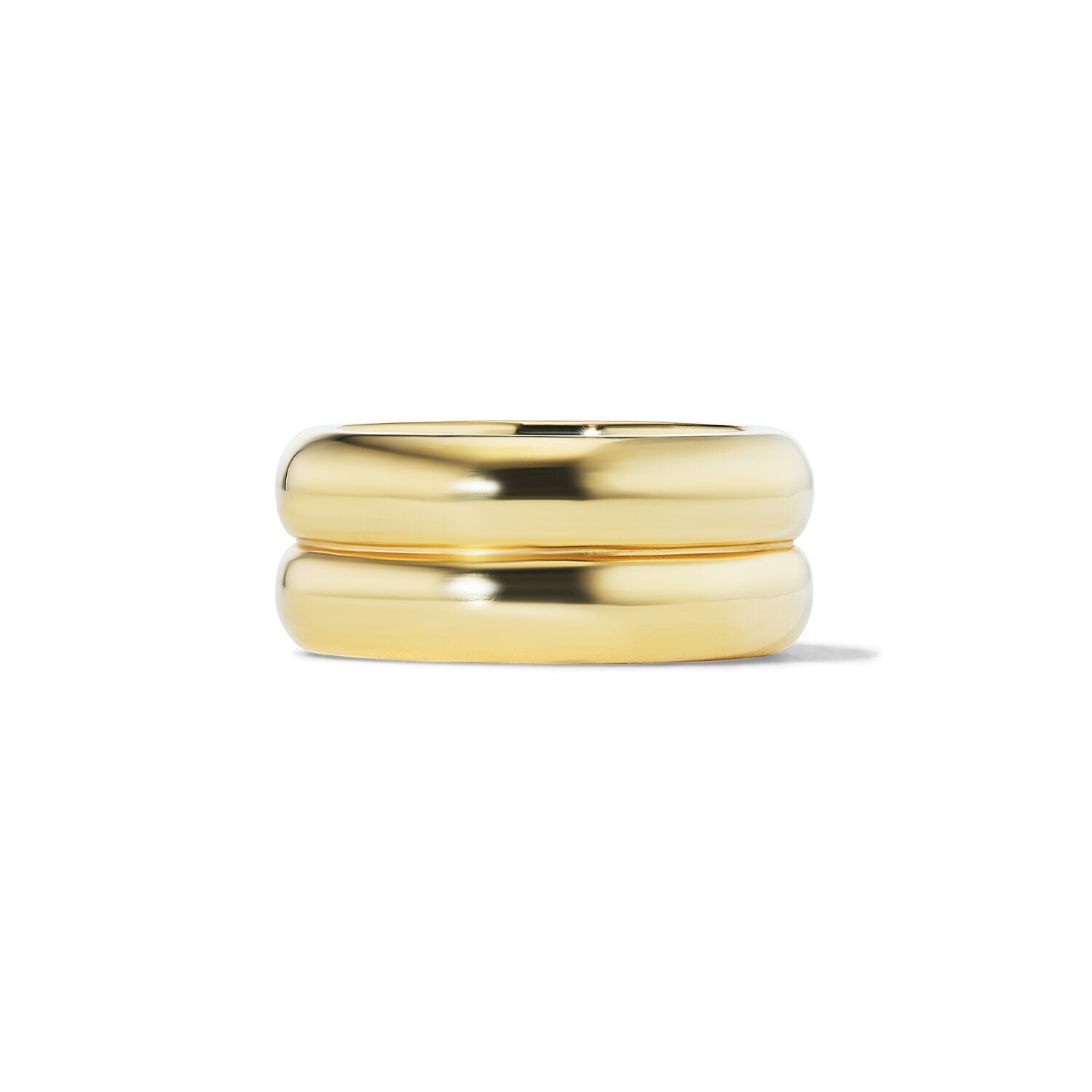 Two gold rings stacked on a white background
