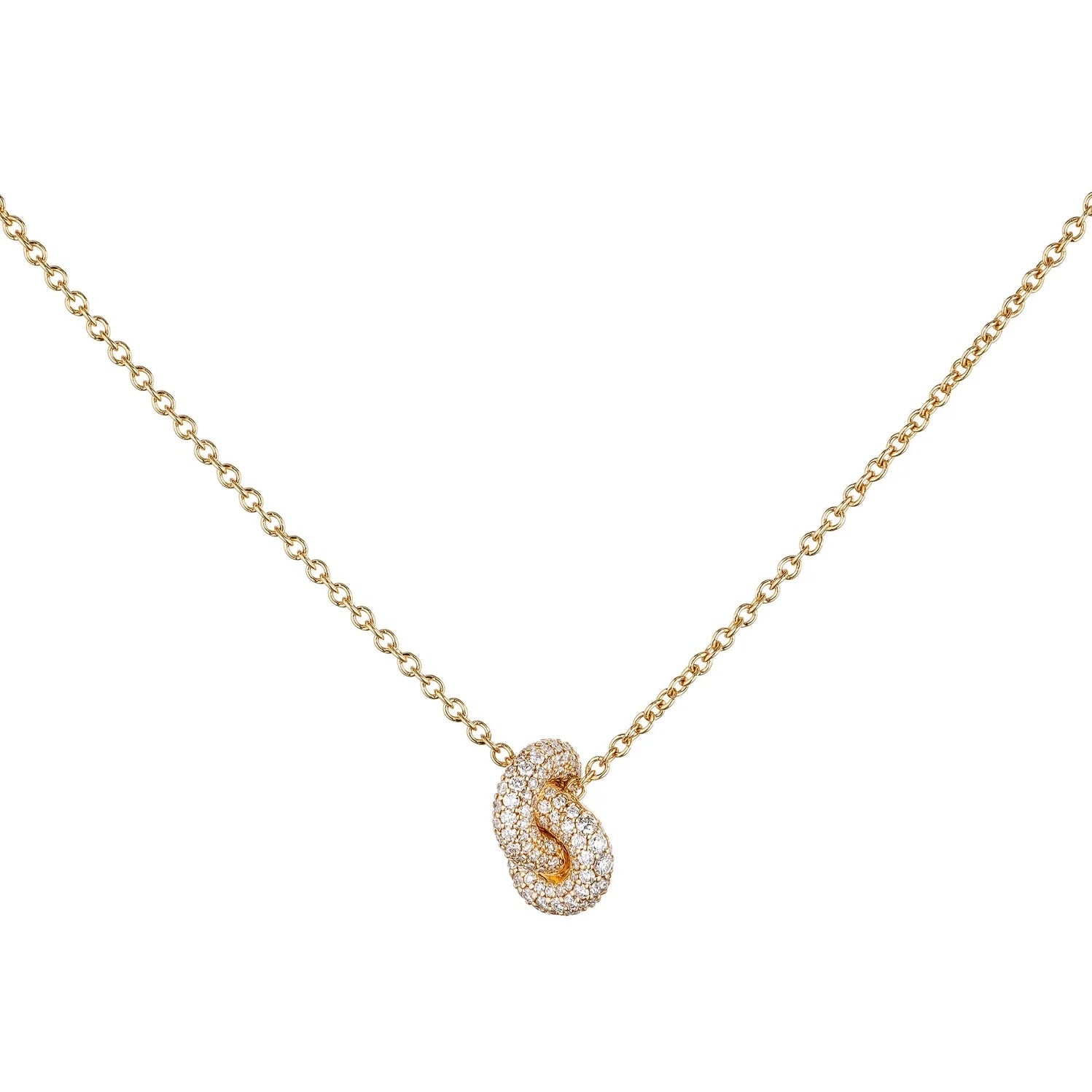Gold necklace with a unique pendant on a white background