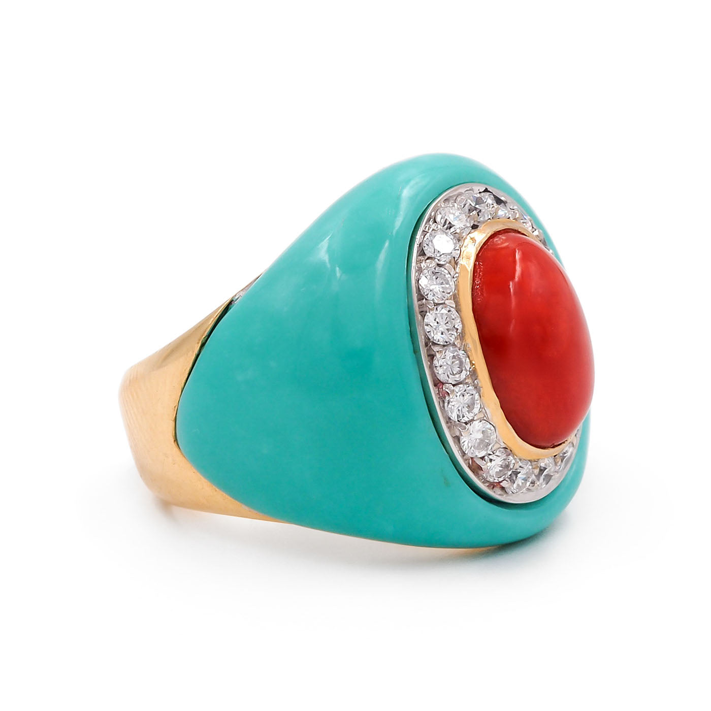Turquoise ring with a red gemstone and gold accents
