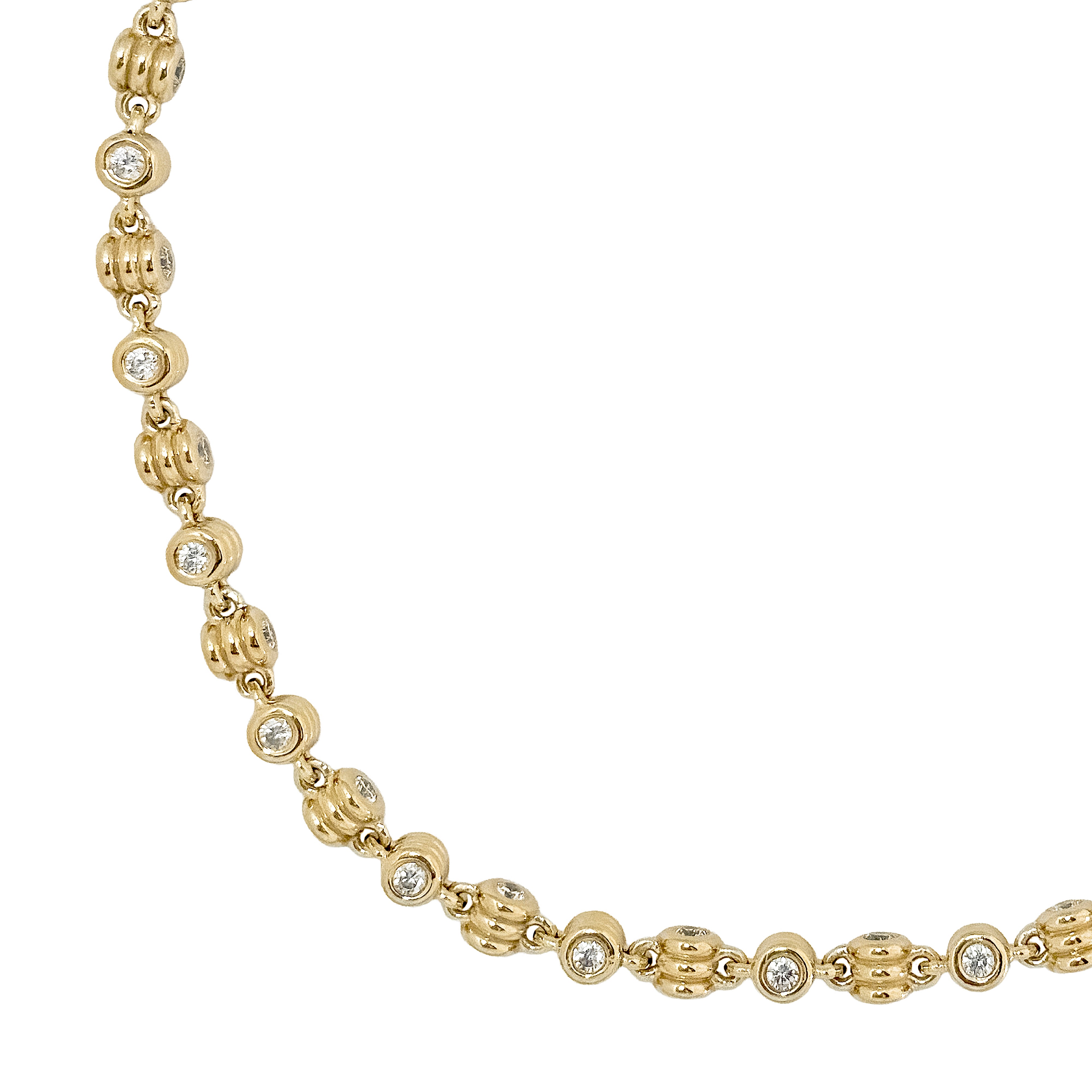 Gold necklace with round beads on a white background