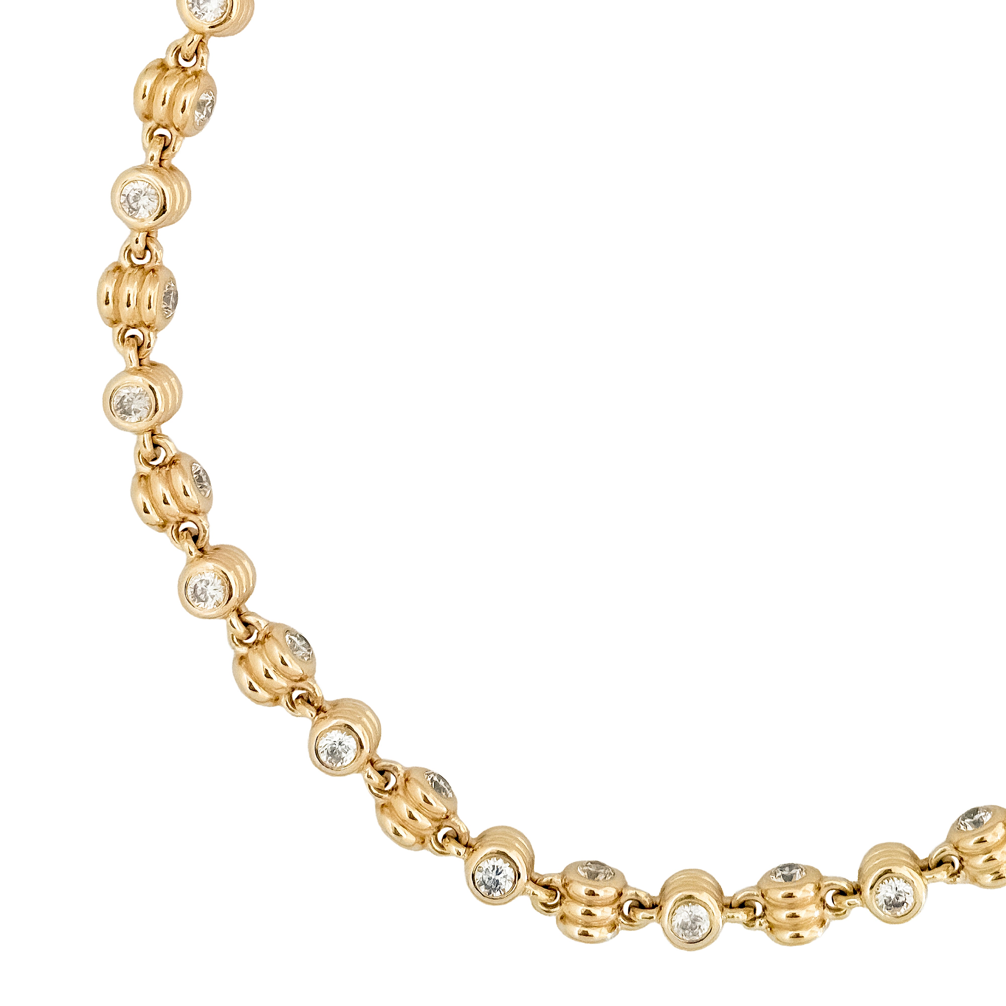 Gold necklace with round beads and embedded diamonds on a white background