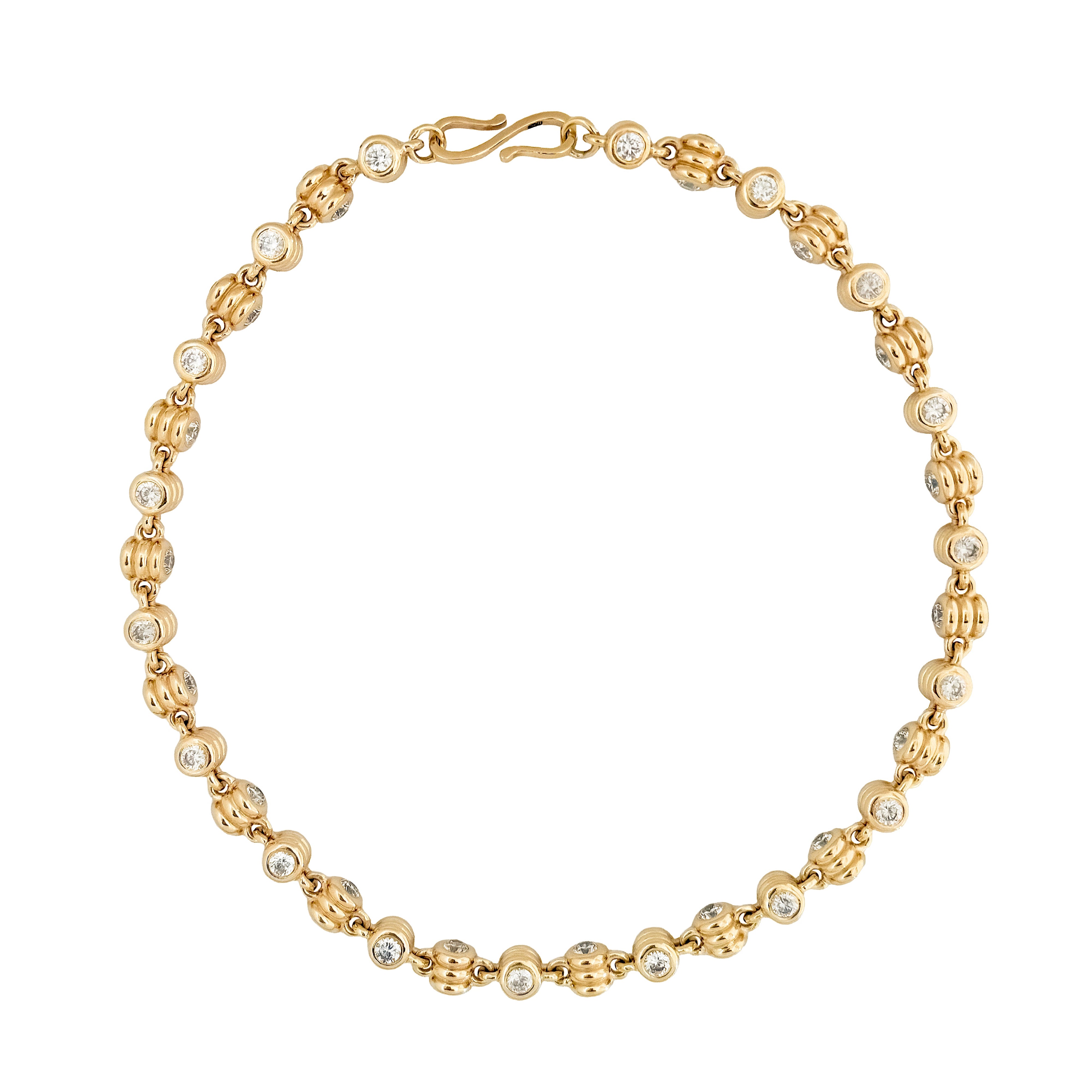 Gold bracelet with diamond accents on a white background