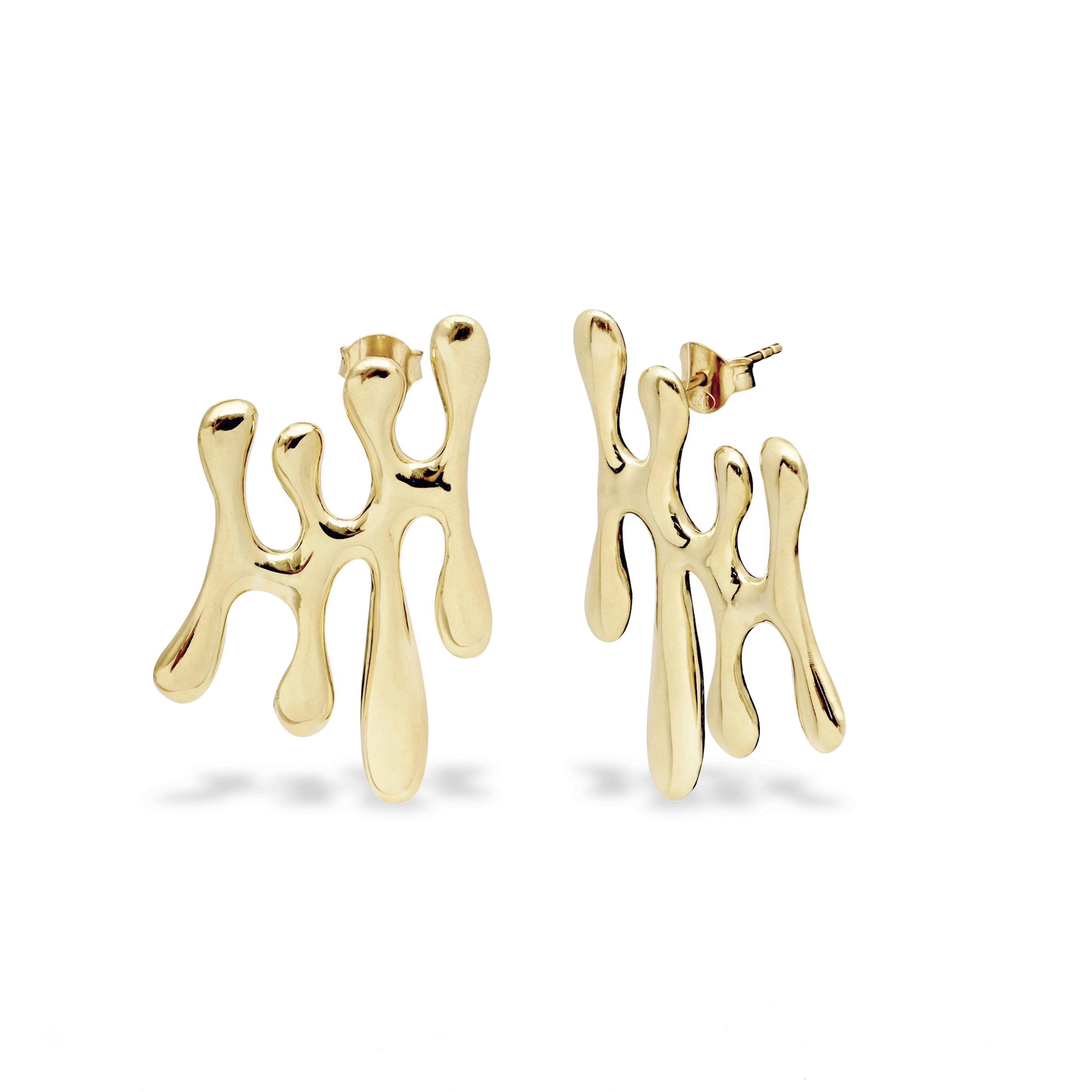 Gold abstract earrings on a white background