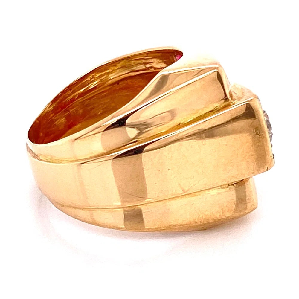 A yellow gold ring with a wide, multi-layered geometric band design, photographed on a clean white background.