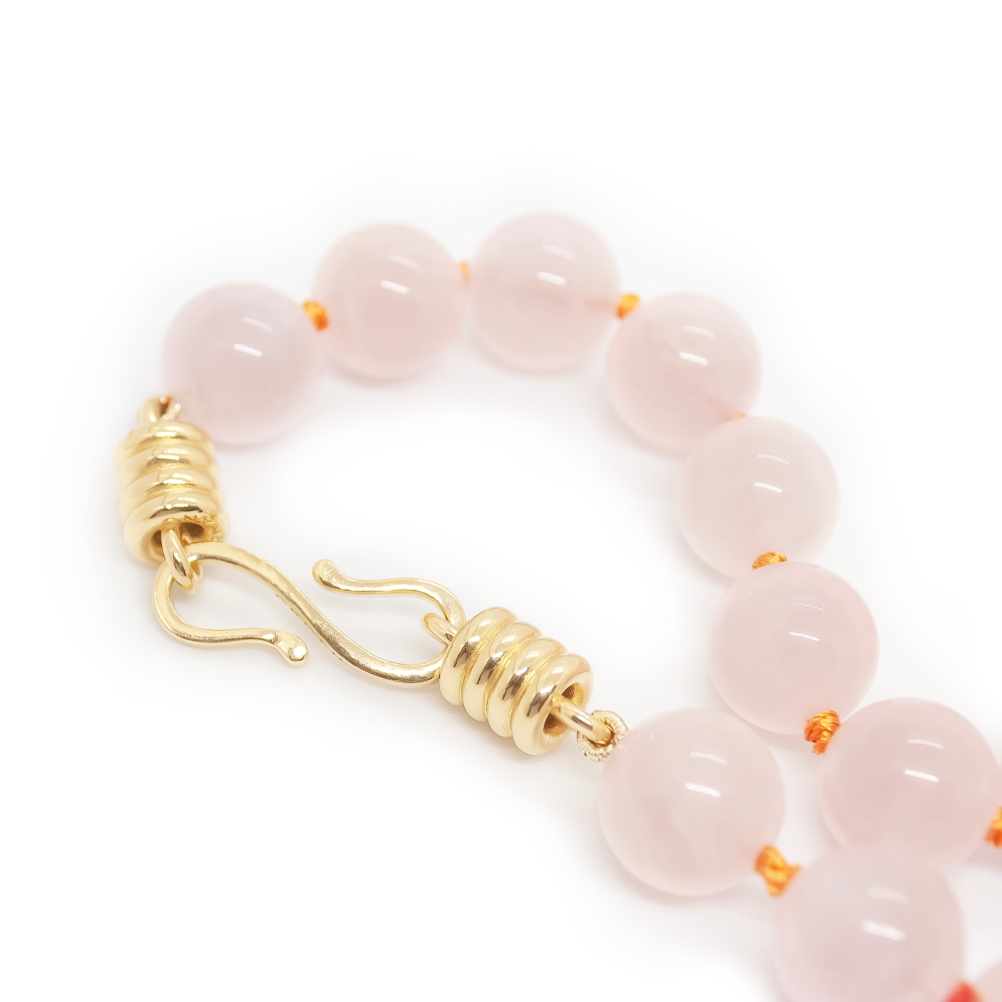Beaded bracelet with gold clasp on a white background