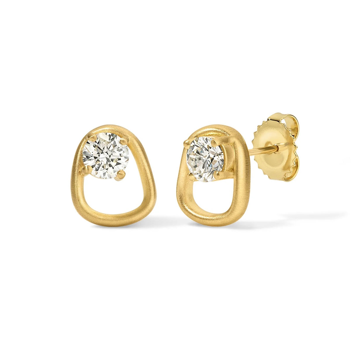 Gold earrings with clear gemstones on a white background