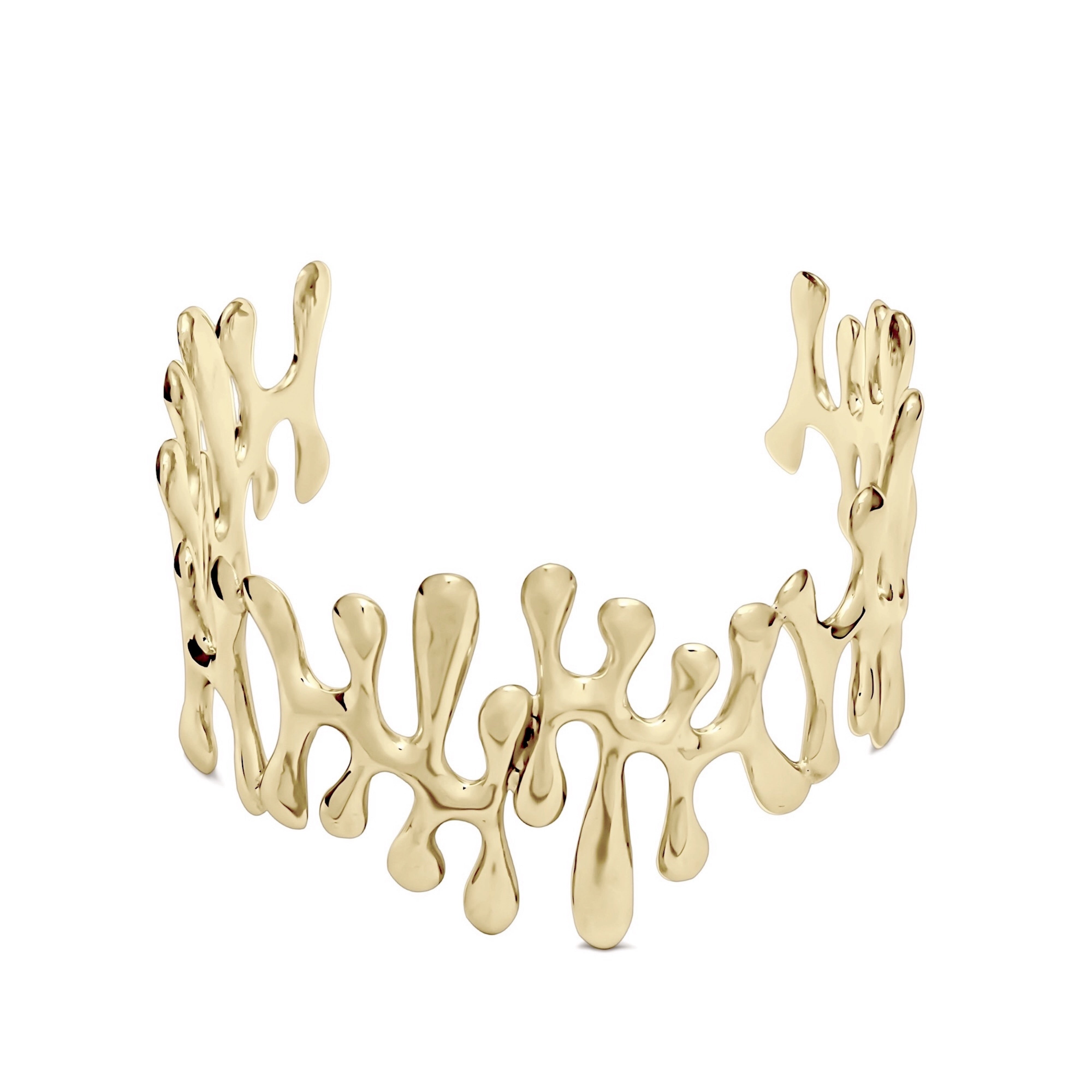 Gold choker necklace on a white background