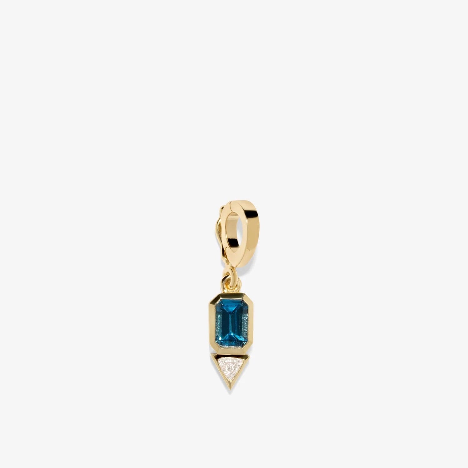 Gold pendant with a blue gemstone on a white background