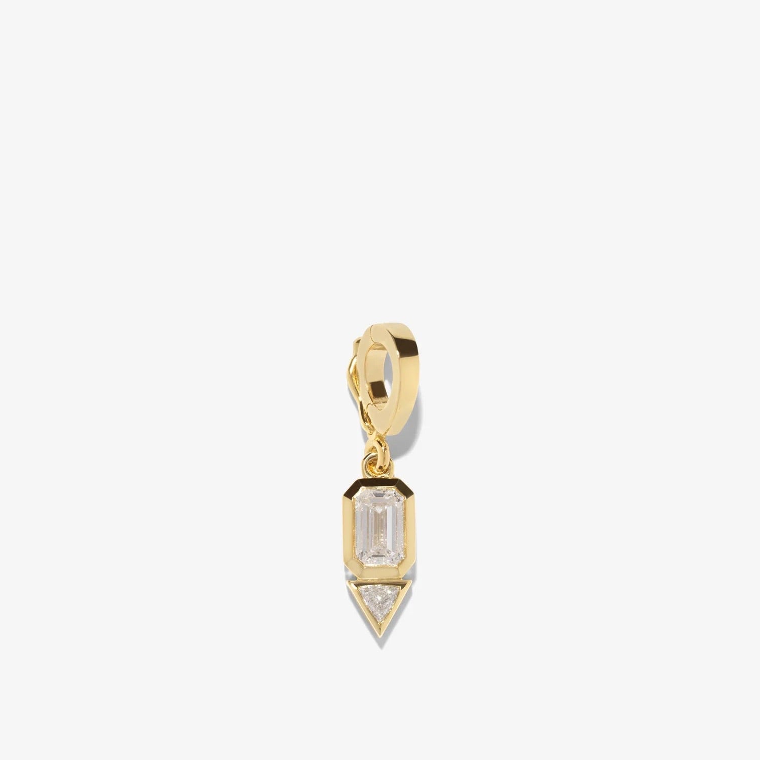 Gold pendant with a clear gemstone on a white background