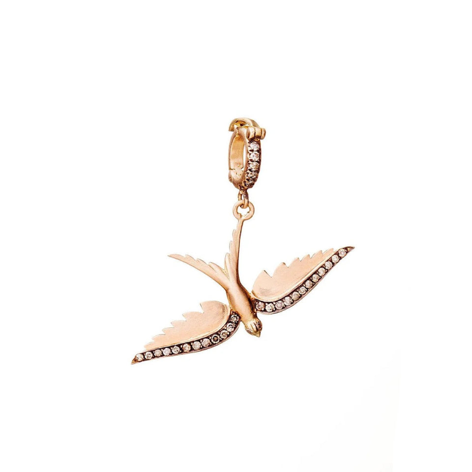 Rose gold bird-shaped earring with small diamonds on a white background