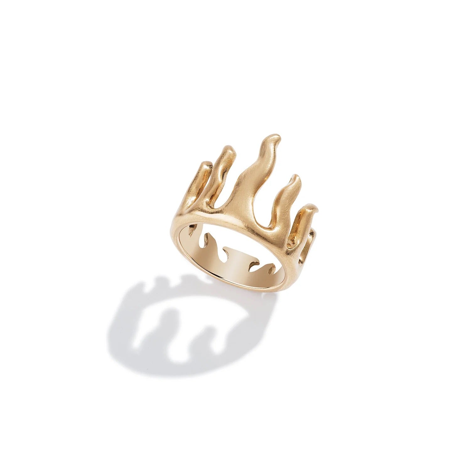 Gold ring with a unique design on a white background