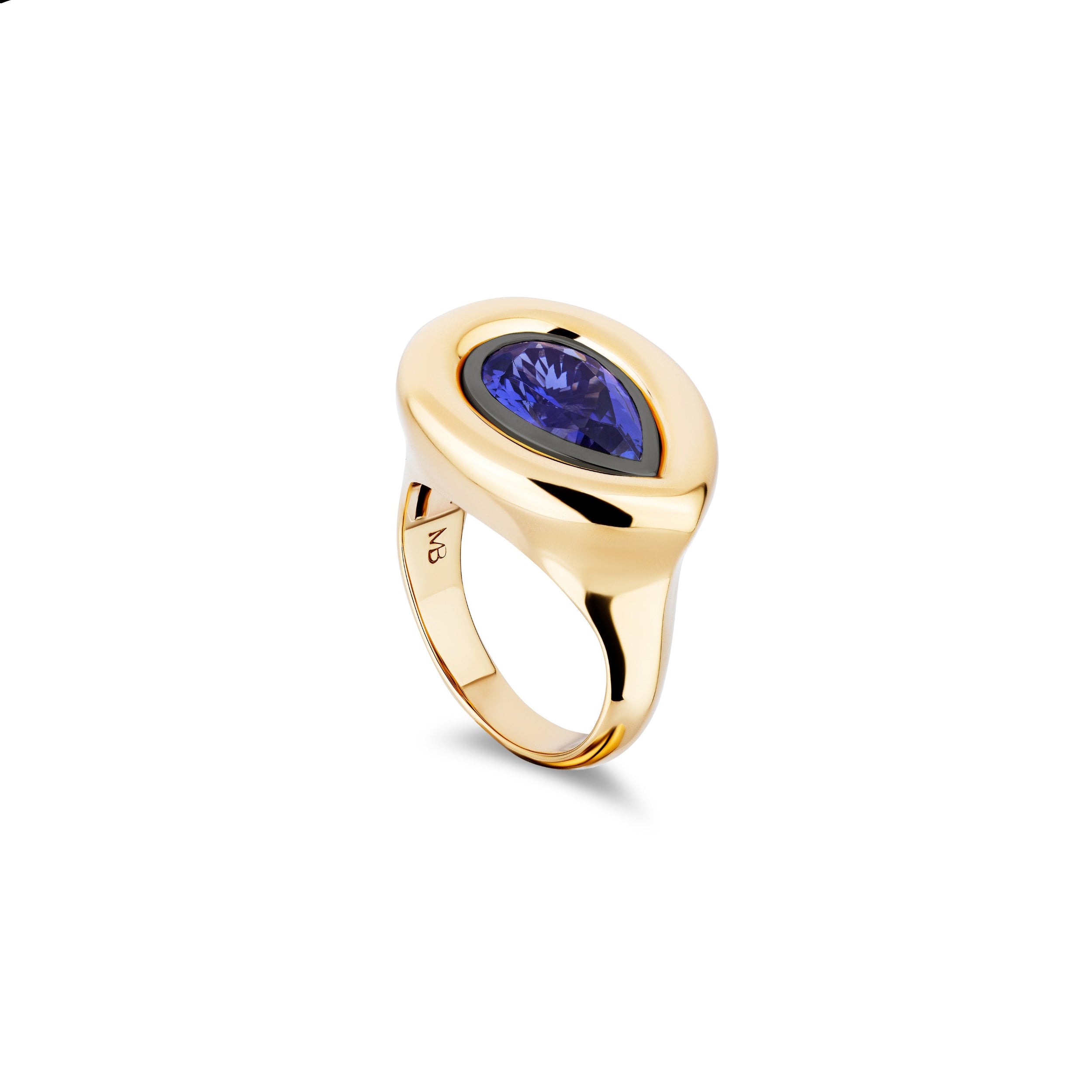 Gold ring with a blue gemstone on a white background