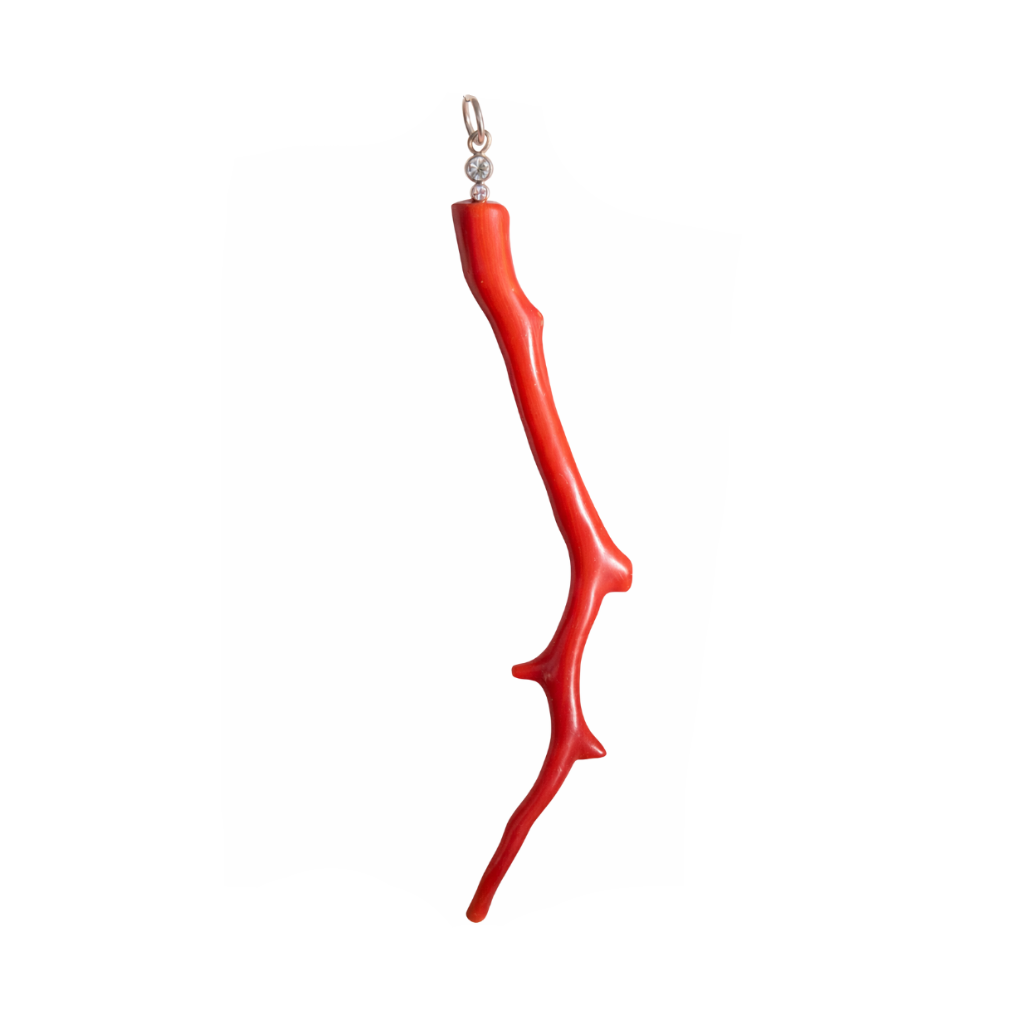 Red coral branch pendant on a white background