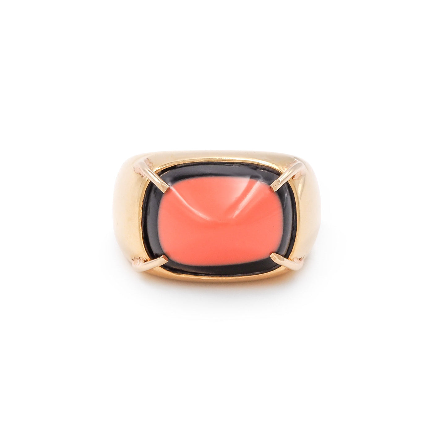 Ring with a pink stone and gold band on a white background