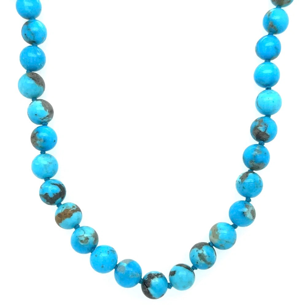 Necklace with blue beads on a white background