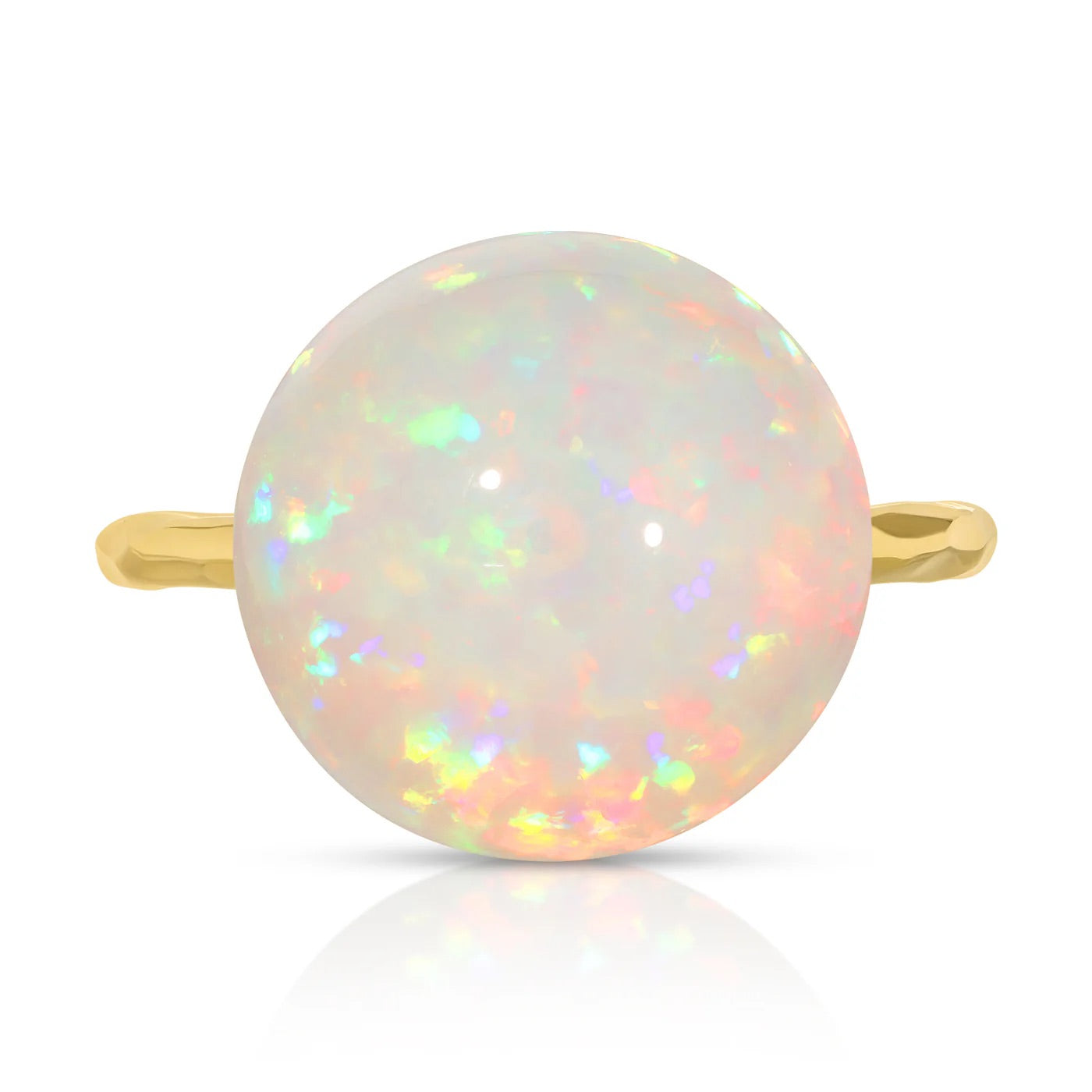 Gold ring with a round opal stone on a white background