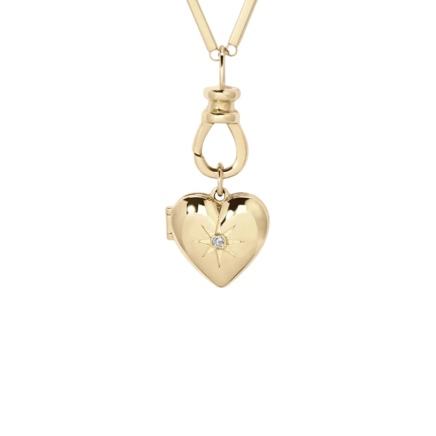 Gold heart-shaped locket with a diamond on a white background