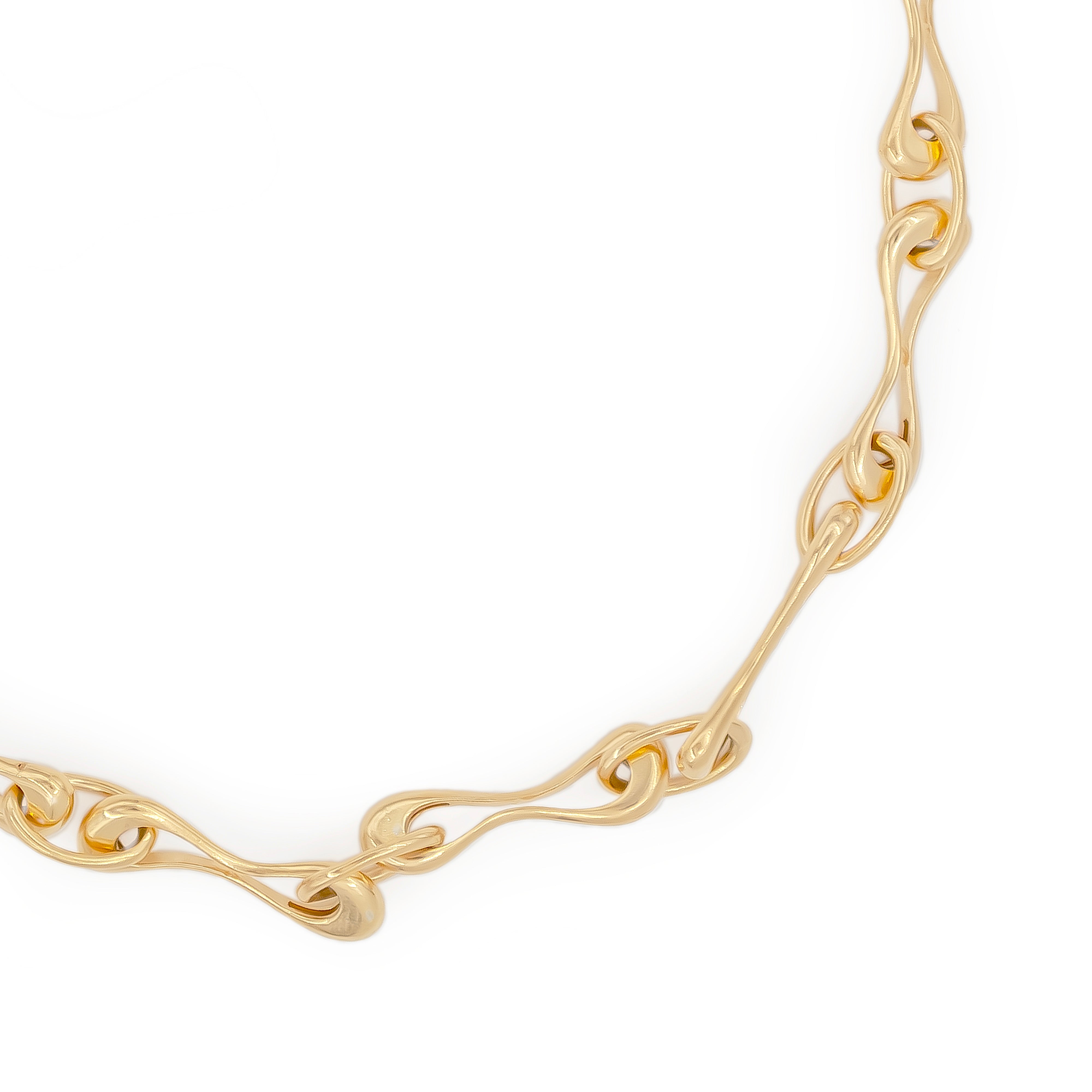 Gold chain necklace on a white background