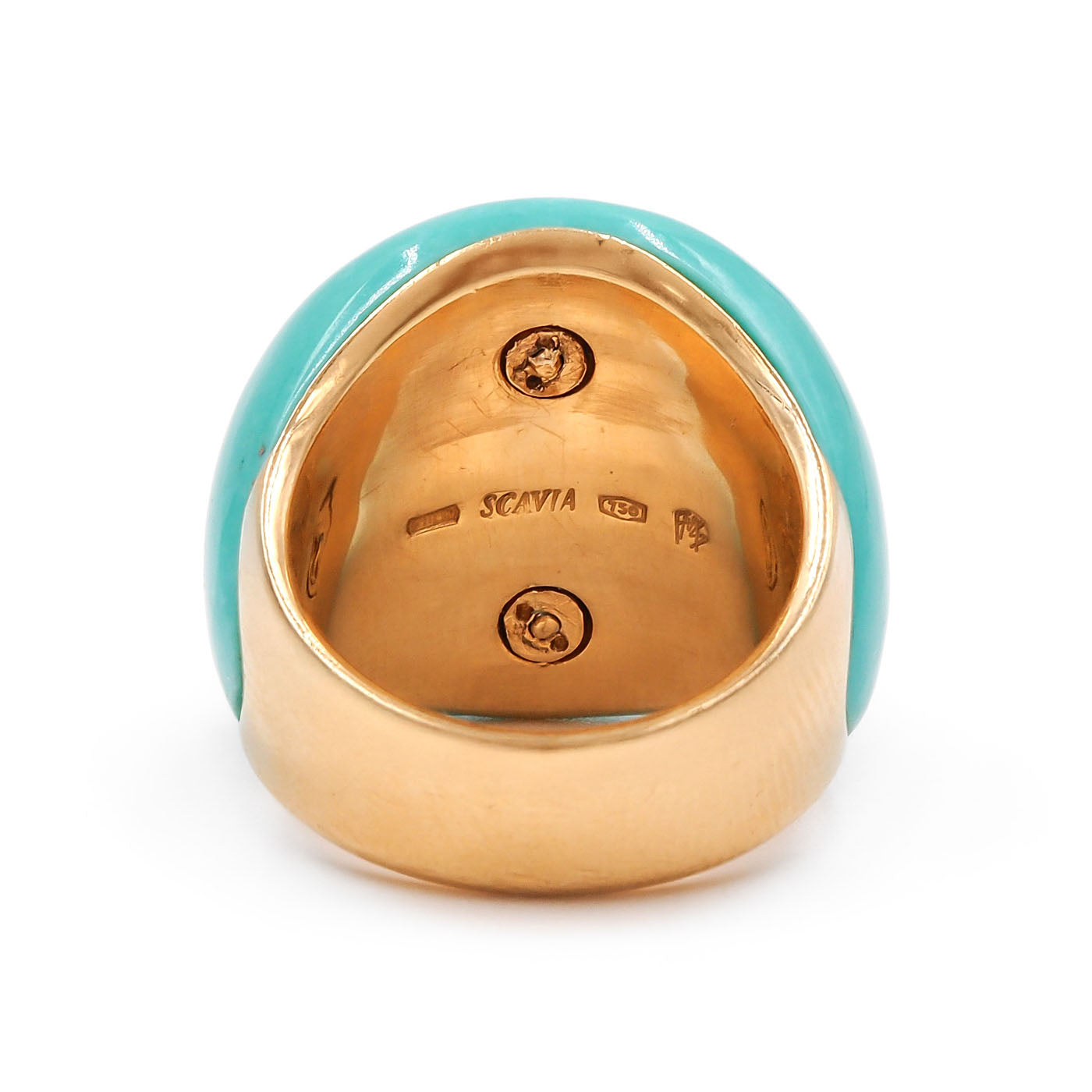Gold ring with turquoise band on a white background