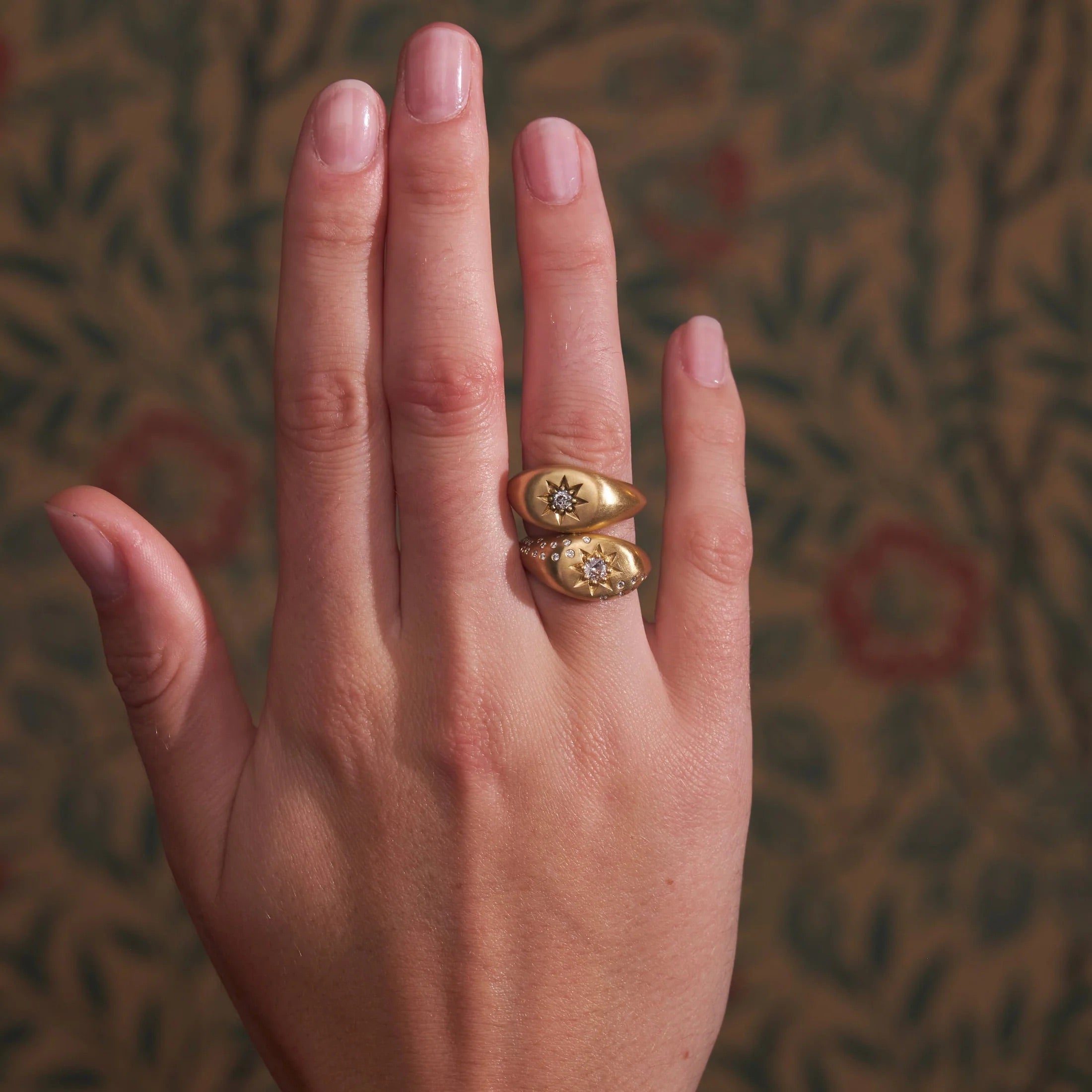 Model wearing Victorian Star diamond signet ring in 18K yellow gold