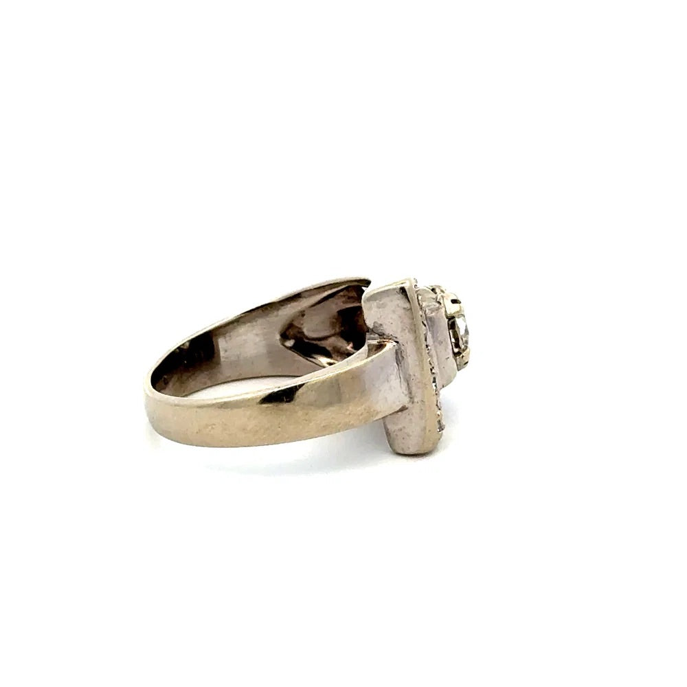 white gold ring with a central gemstone on a white background
