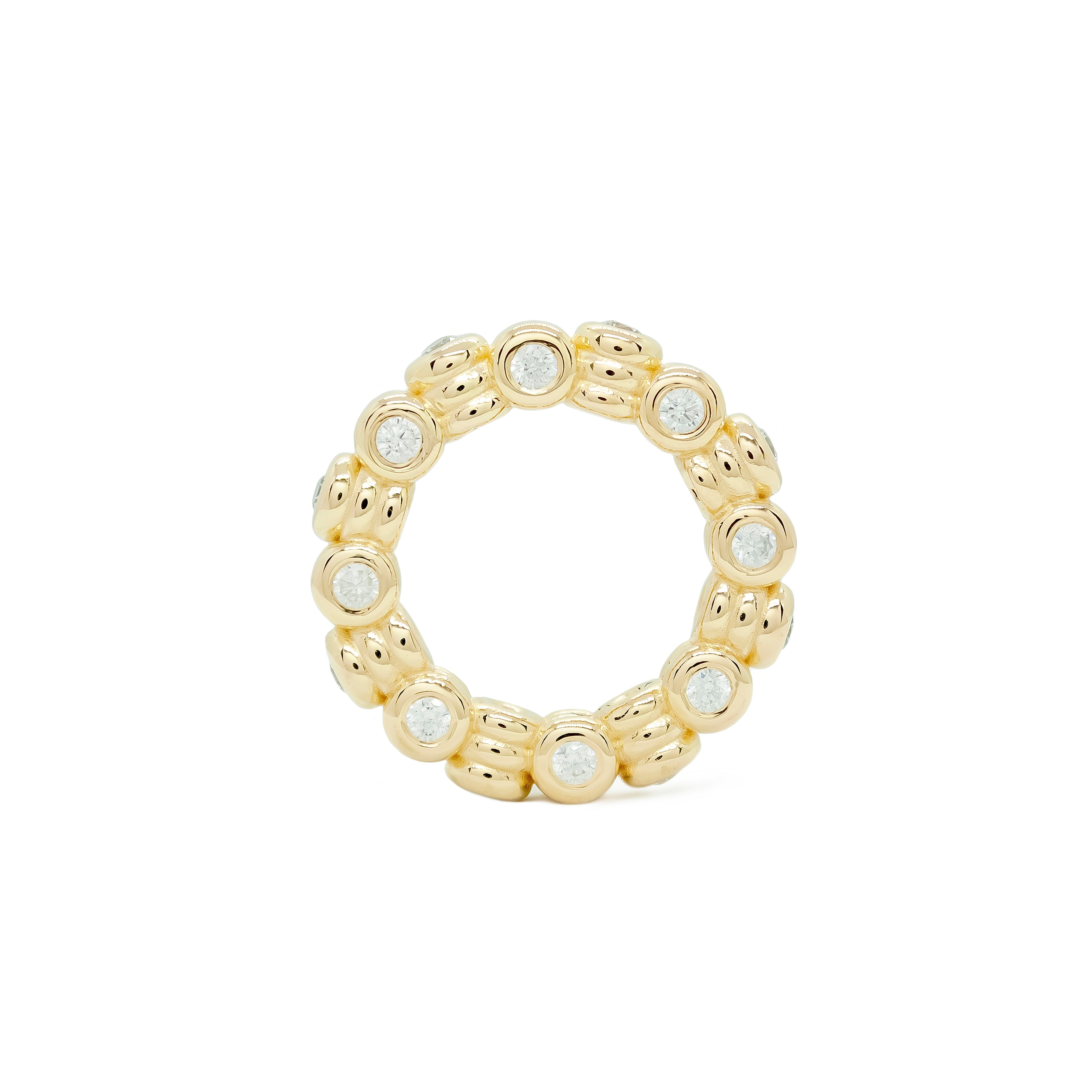 Gold ring with embedded stones on a white background