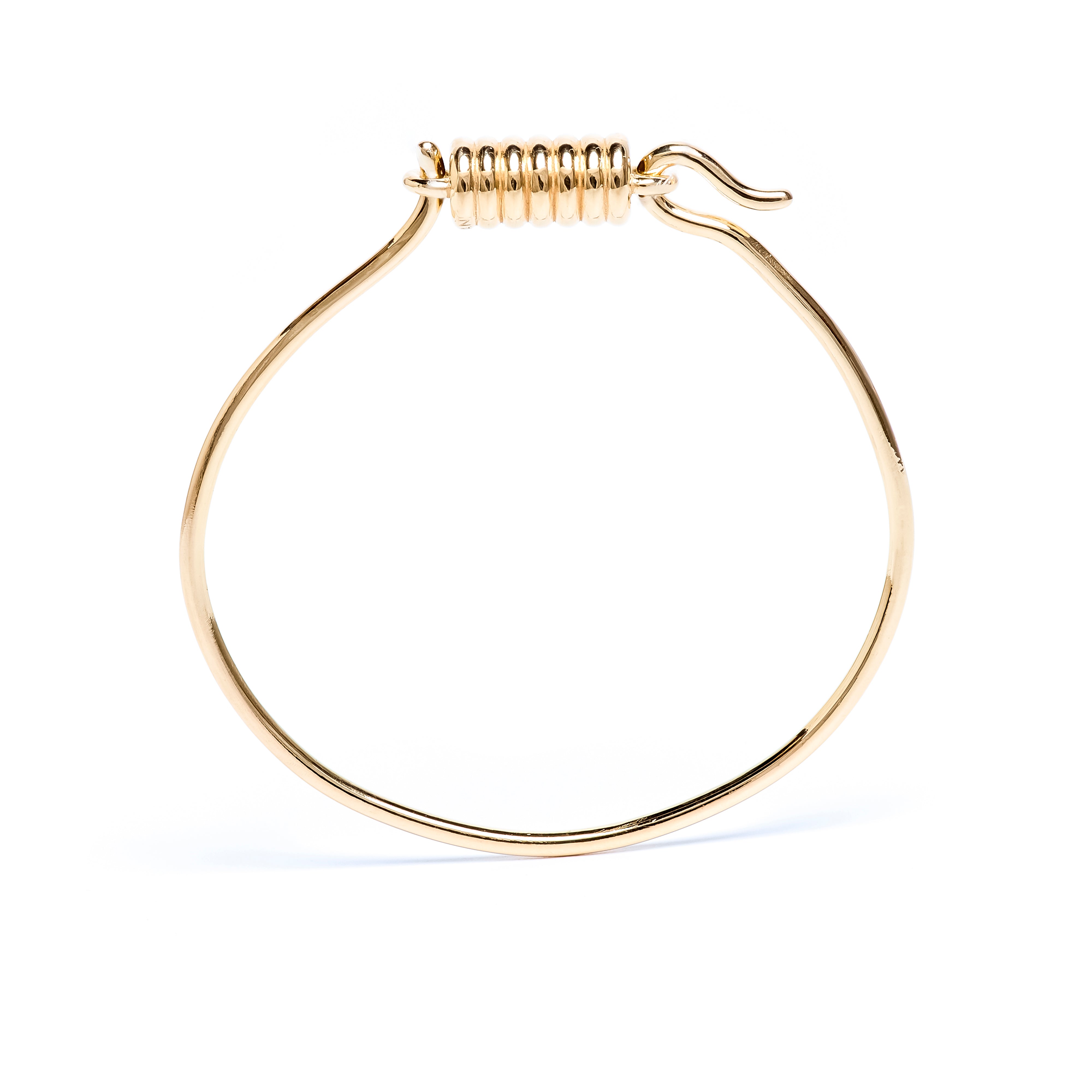Gold hoop bracelet on a white background