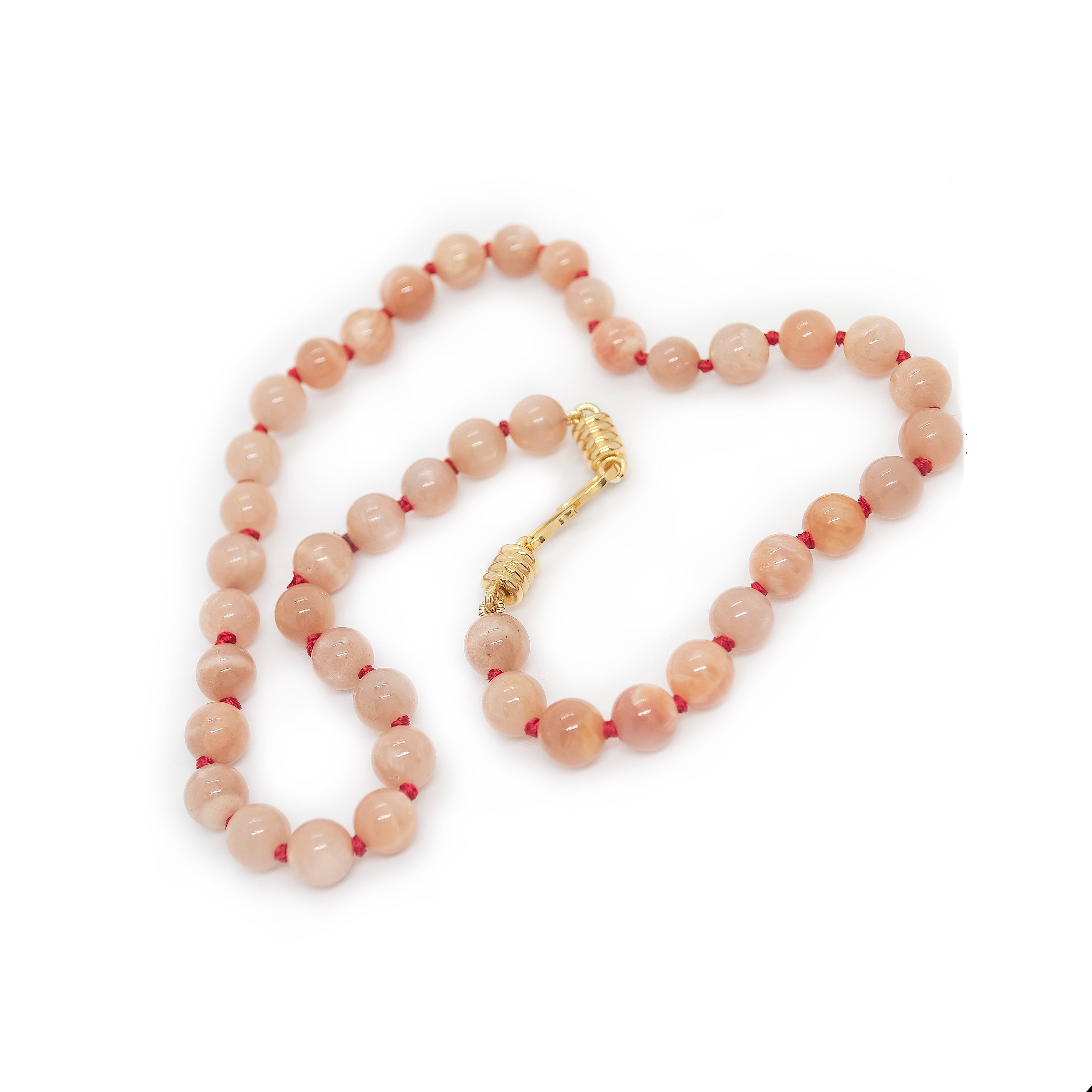 Pink Beaded necklace on white background