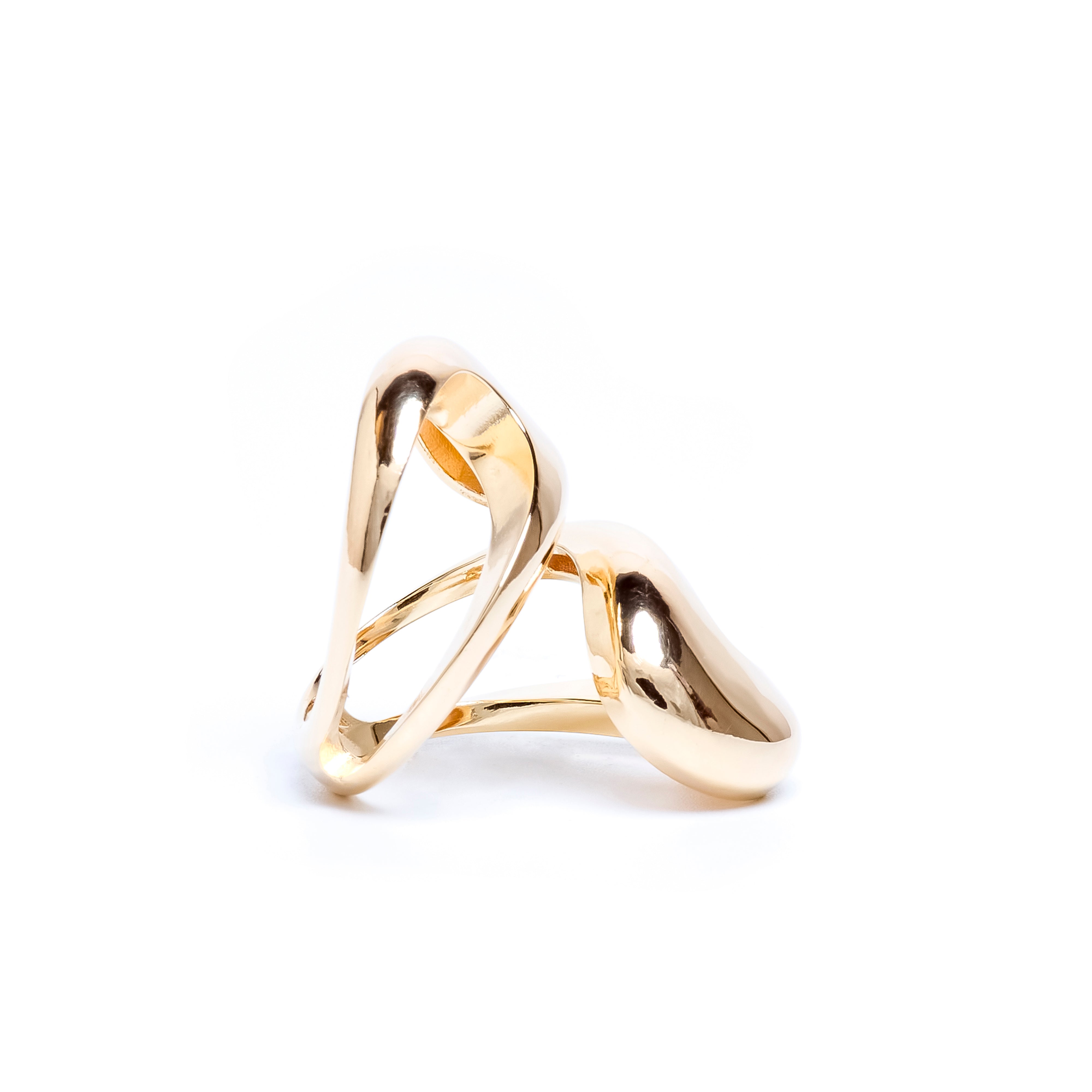 Gold ring with a modern design on a white background