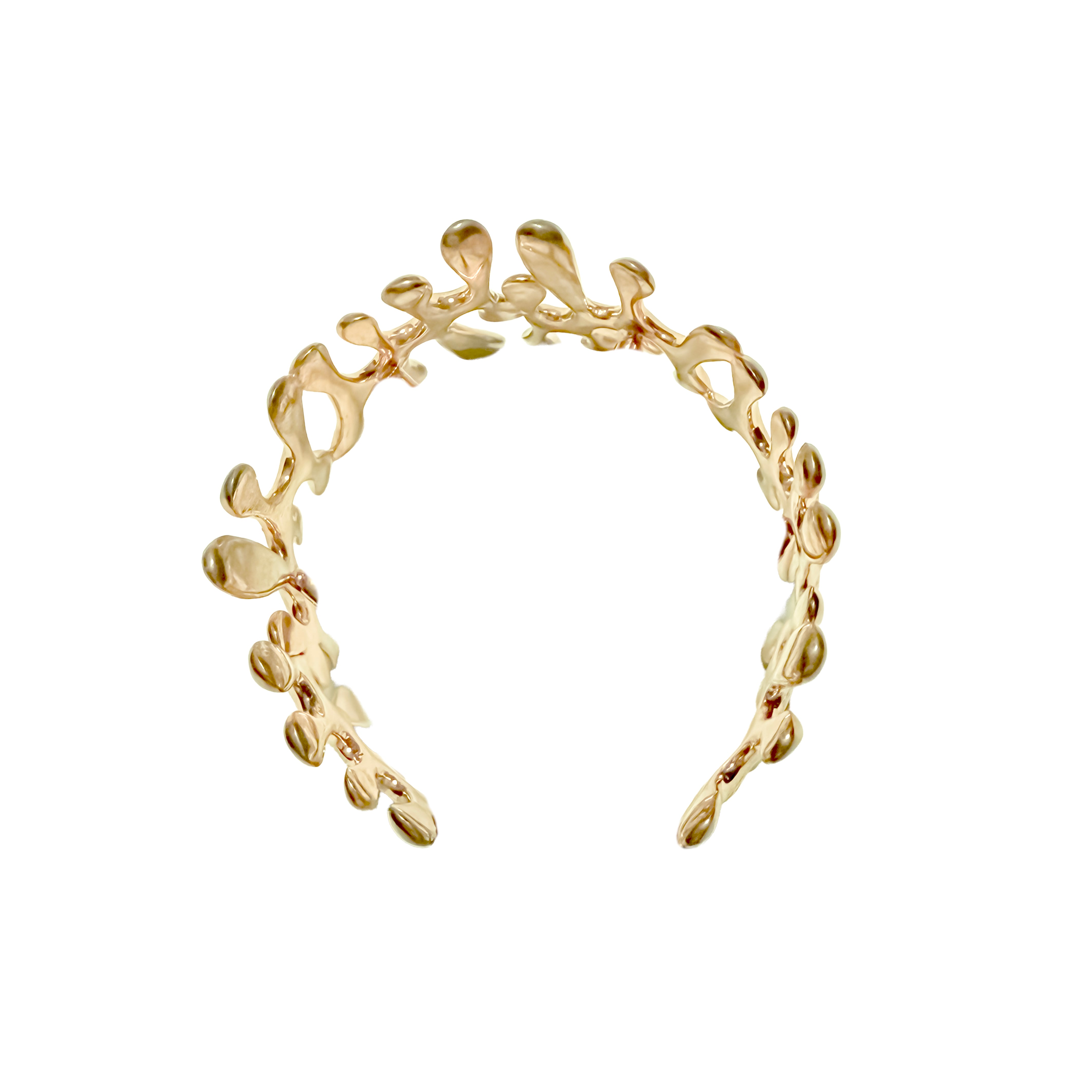 Gold bracelet with leaf-like design on a white background