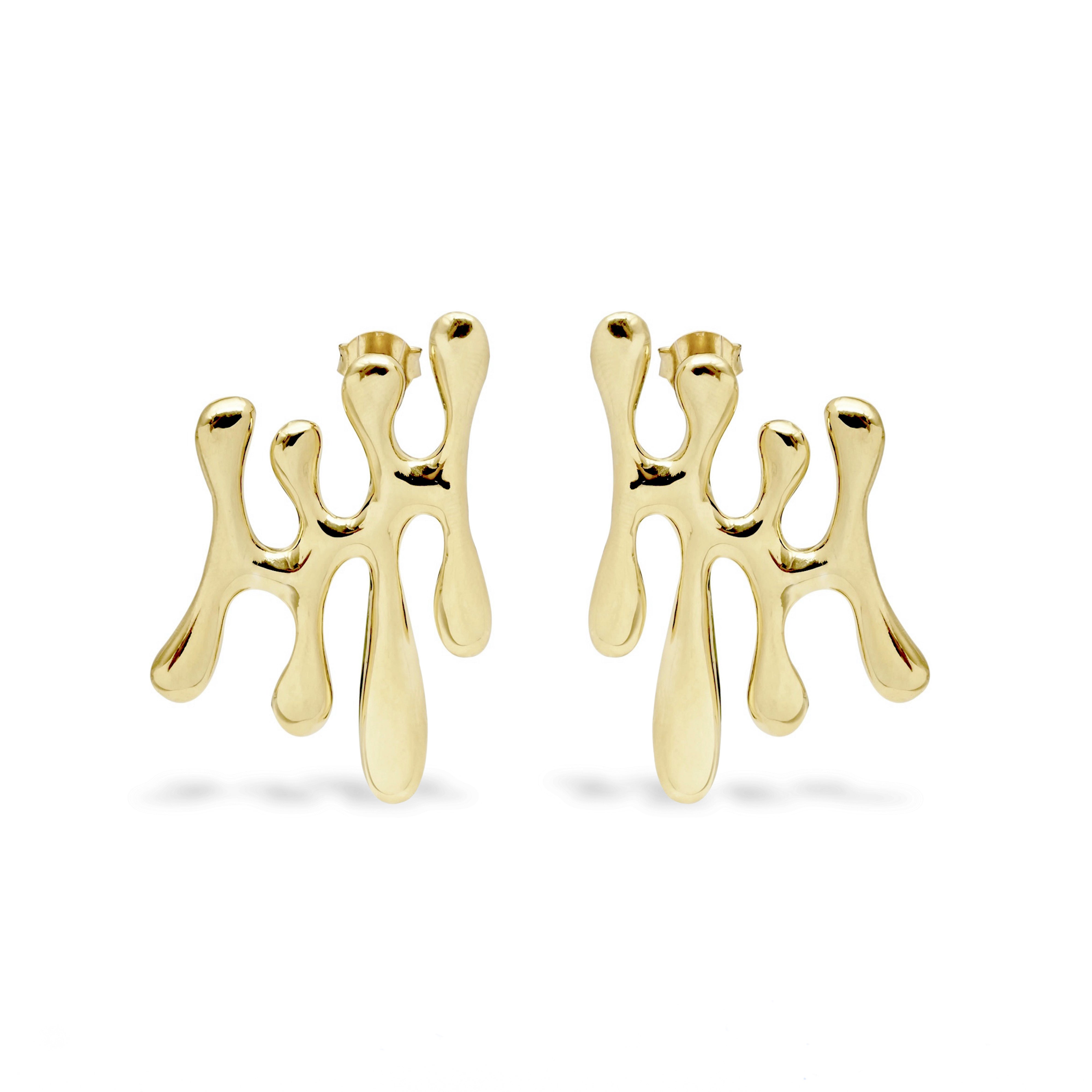 Gold abstract earrings on a white background