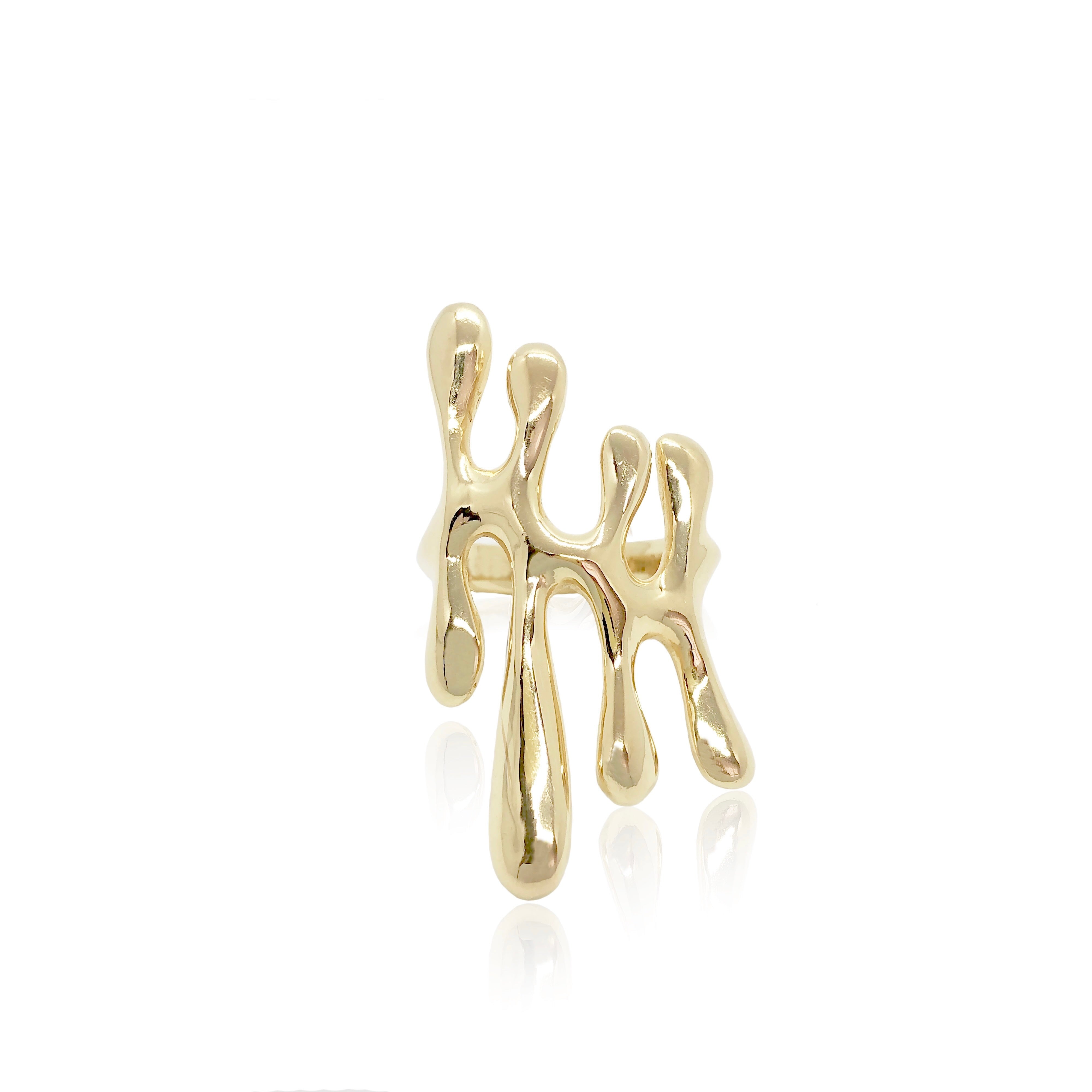 Gold abstract ring on a white background