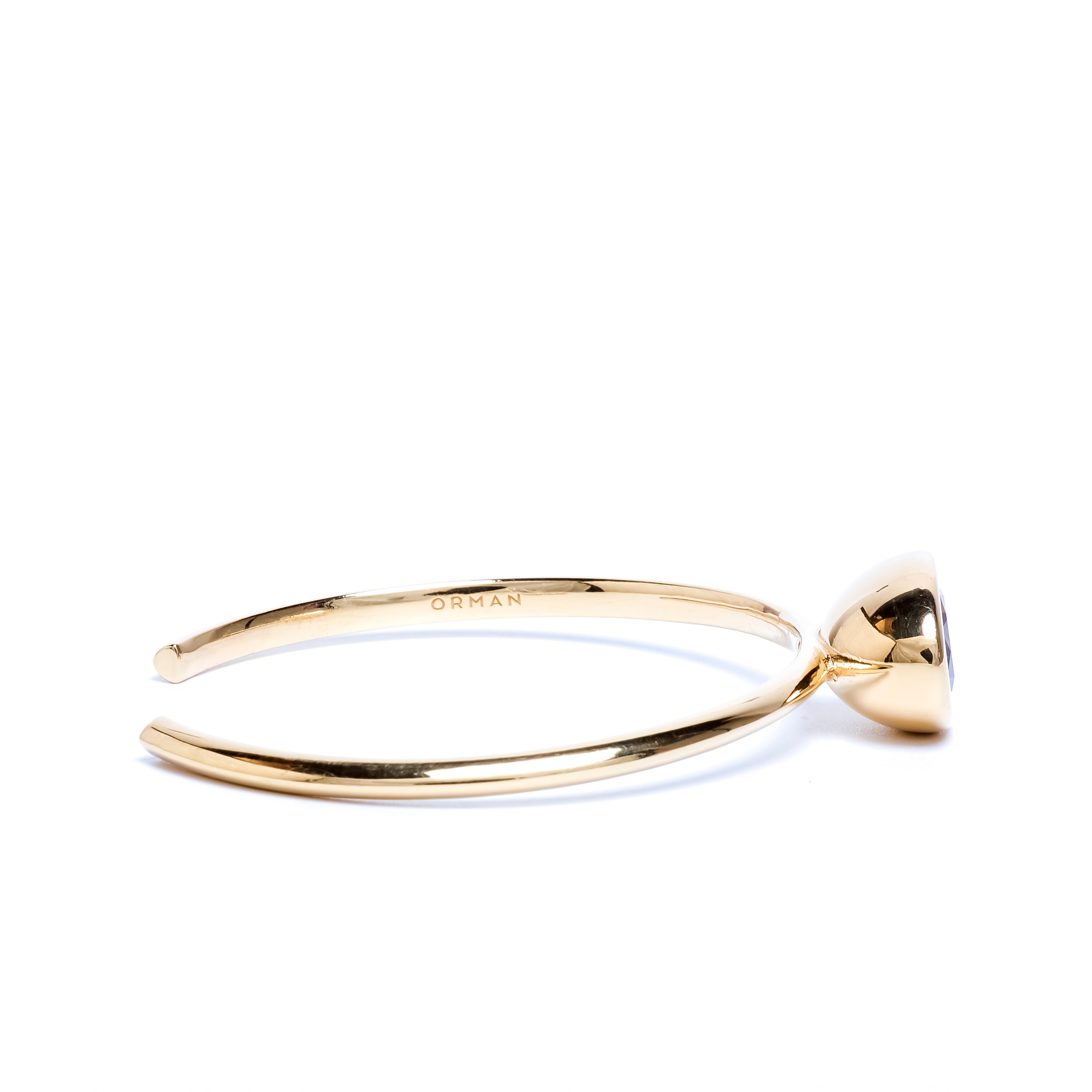 Gold ring with a diamond on a white background